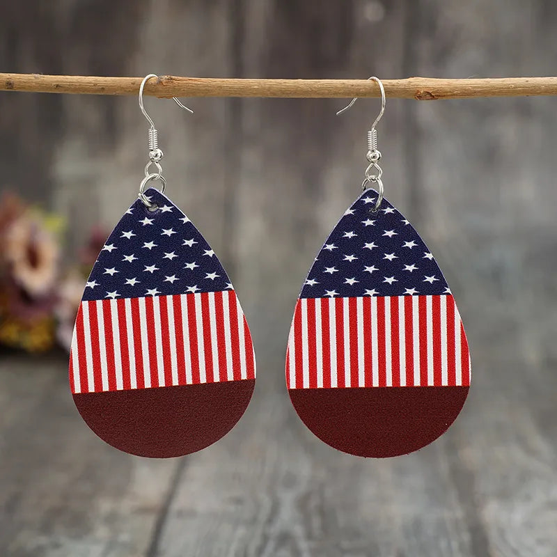 Teardrop earrings in stars and stripes design made of PU leather and alloy.