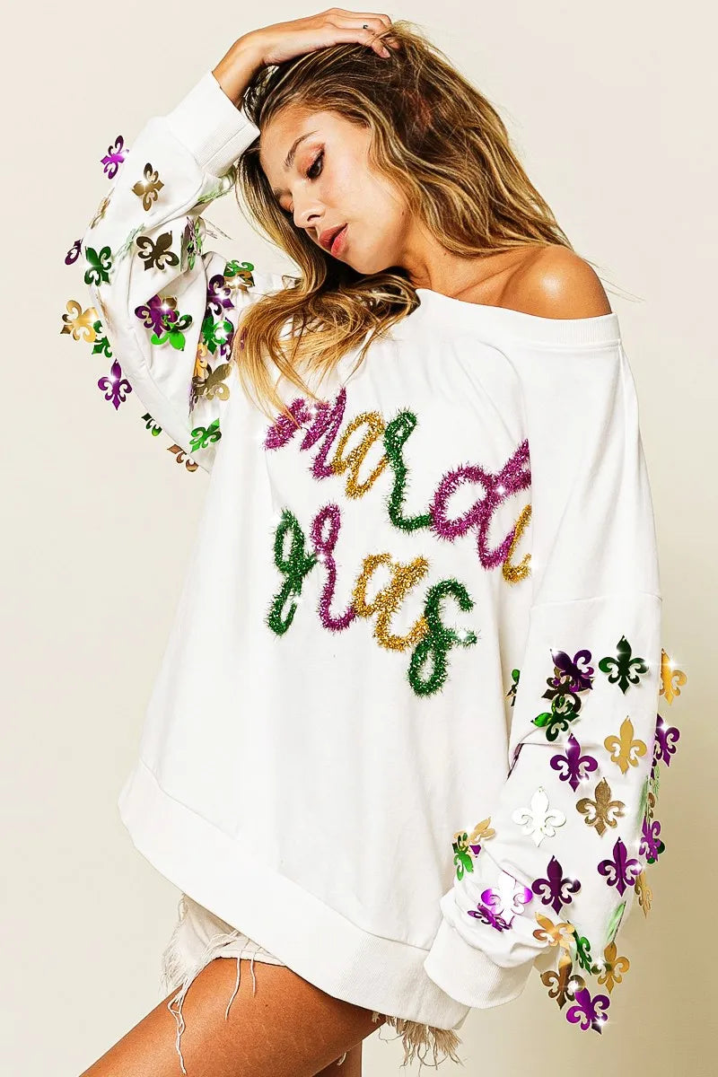 Pullover with Fleur De Lis designs on sleeves in soft fabric for Mardi Gras casual wear