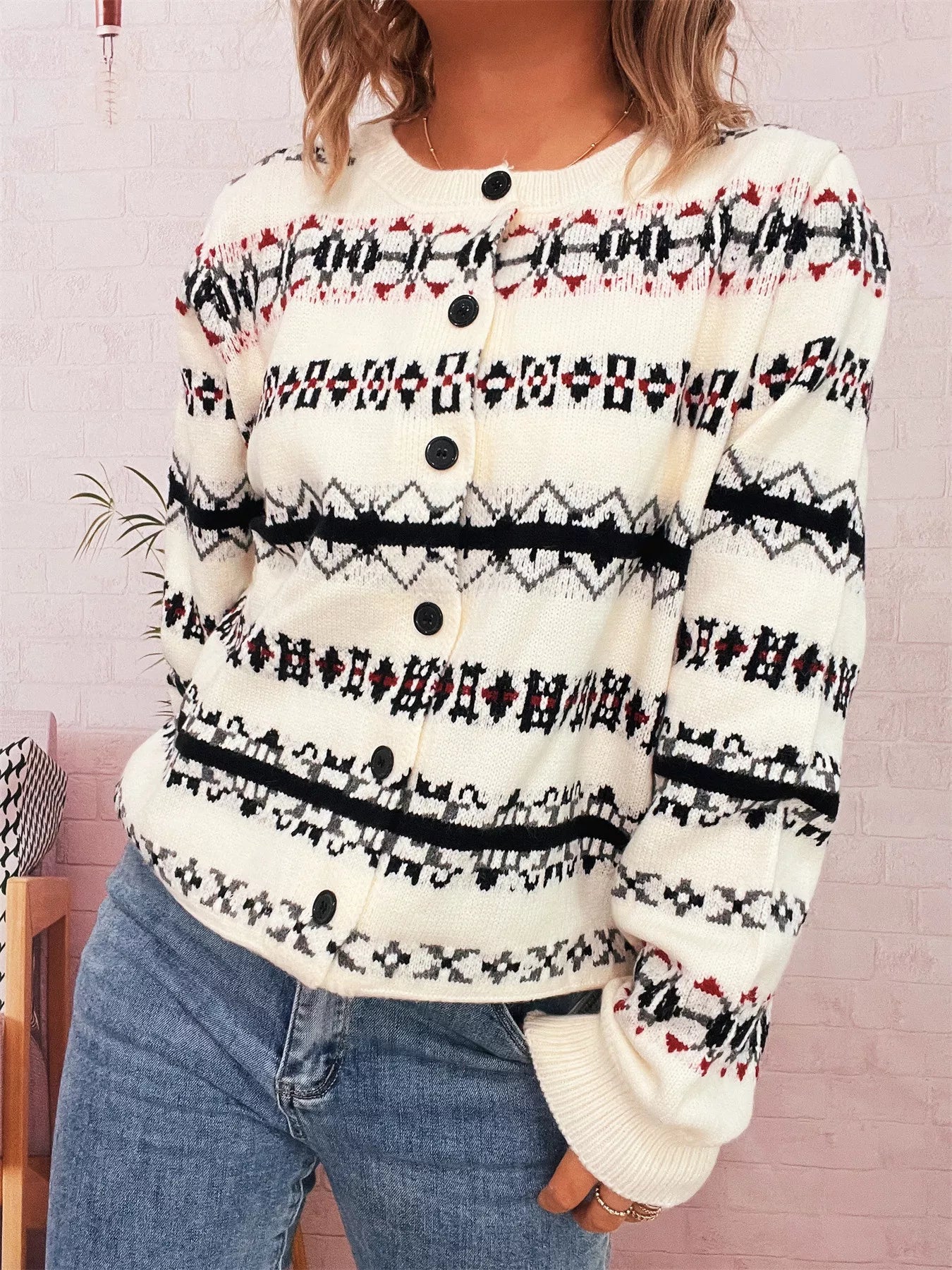 A vintage pattern button-down cardigan made of 100% polyester with a slightly stretchy fit.