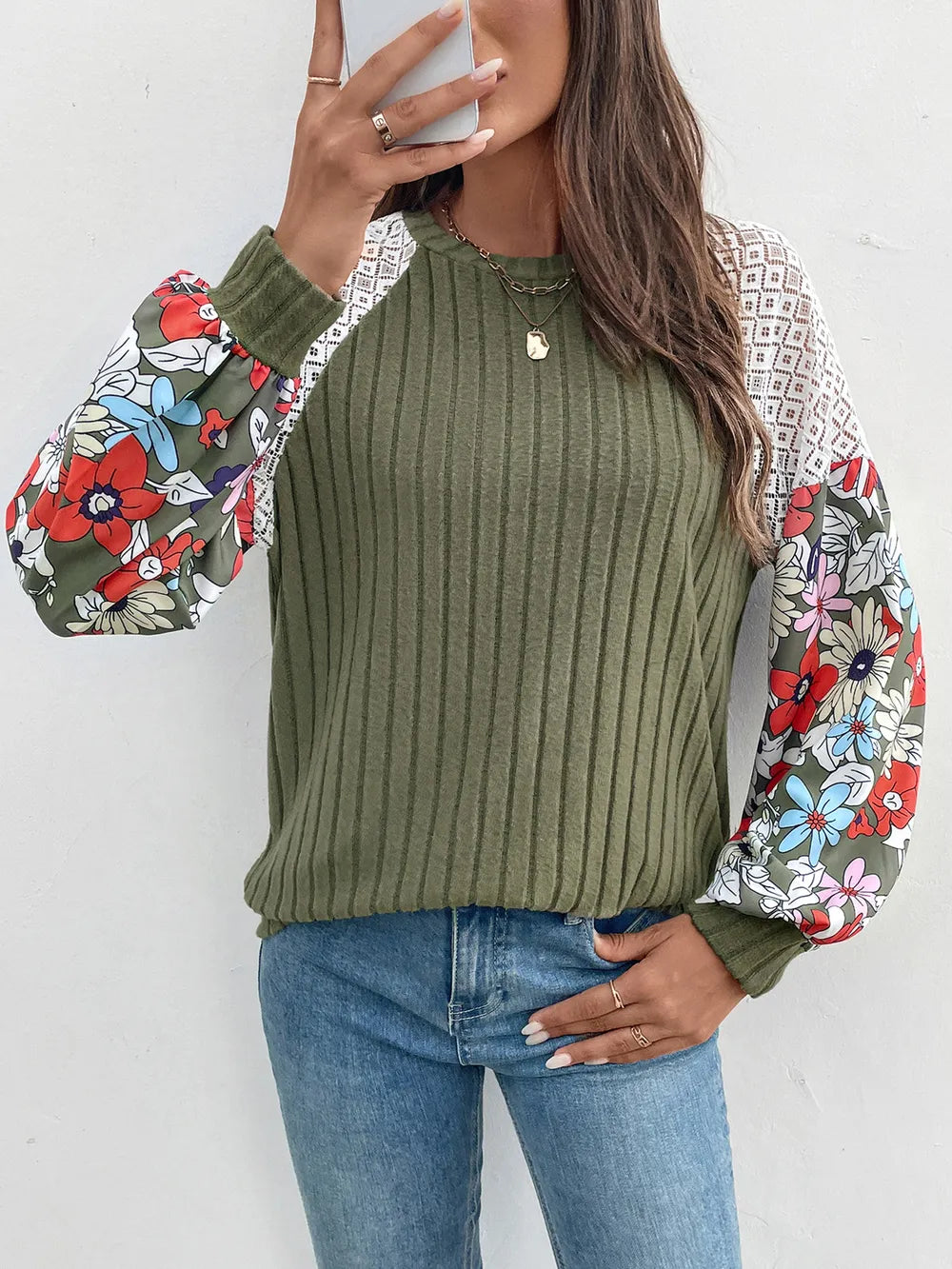 Long sleeve round neck knit top in a polyester blend with moderate stretch.