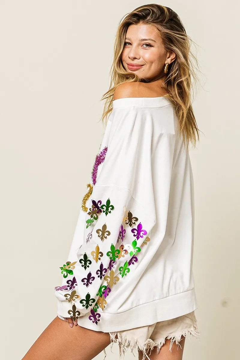 Lightweight pullover with Fleur De Lis sleeve designs in soft-washed fabric for comfort.