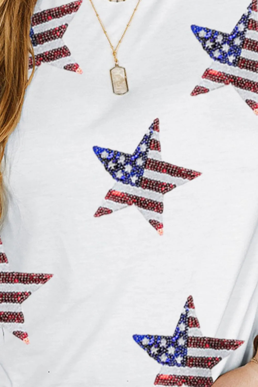 Plus size round neck t-shirt with short sleeves and sequin star design.