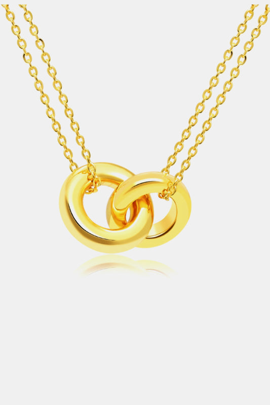 Golden brass necklace with linked ring pendant on a double chain.
