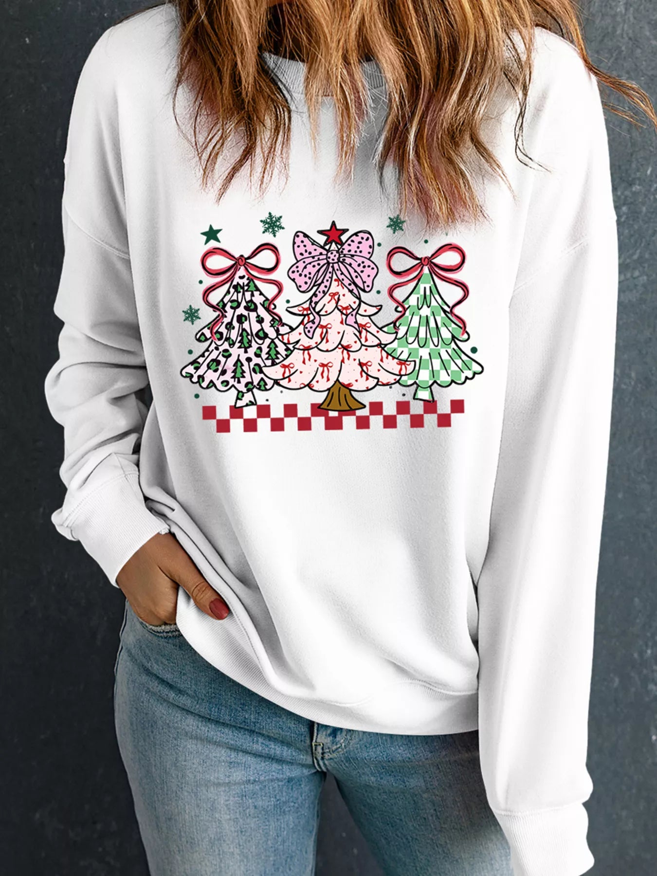 A cozy graphic sweatshirt featuring a Christmas tree design in a soft fabric blend.