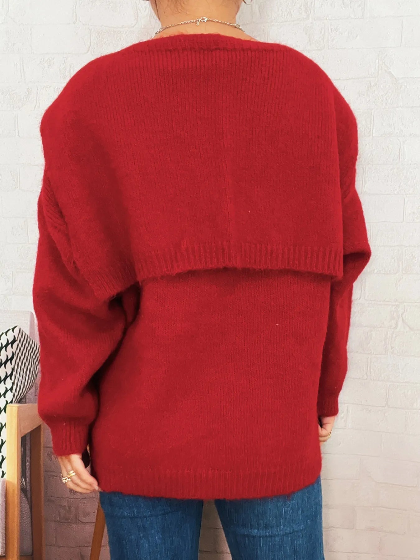 Ribbed hem V-neck sweater with shawl in a slightly stretchy 100% polyester fabric.