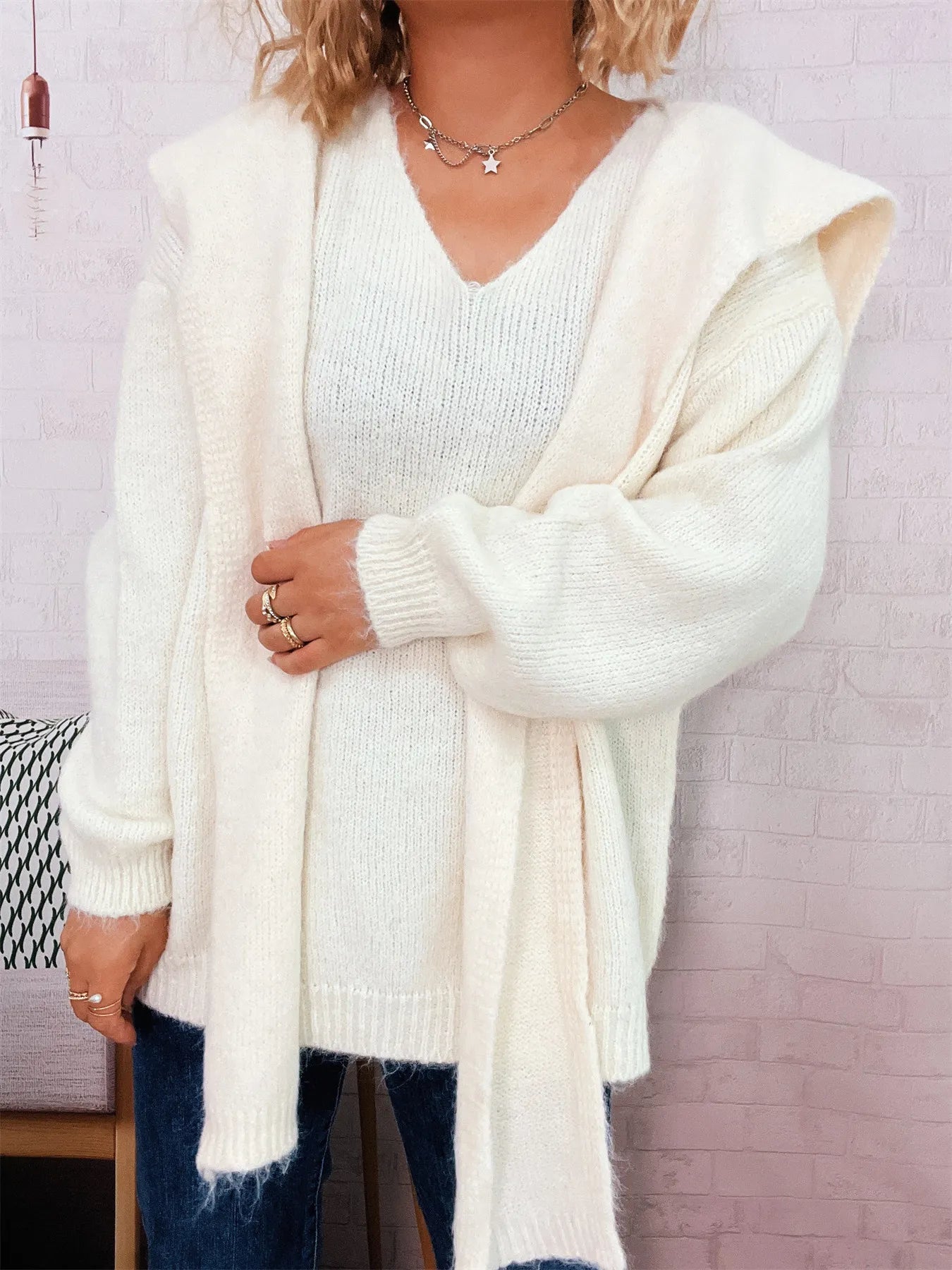 Ribbed hem V-neck sweater with shawl, made of slightly stretchy 100% polyester.