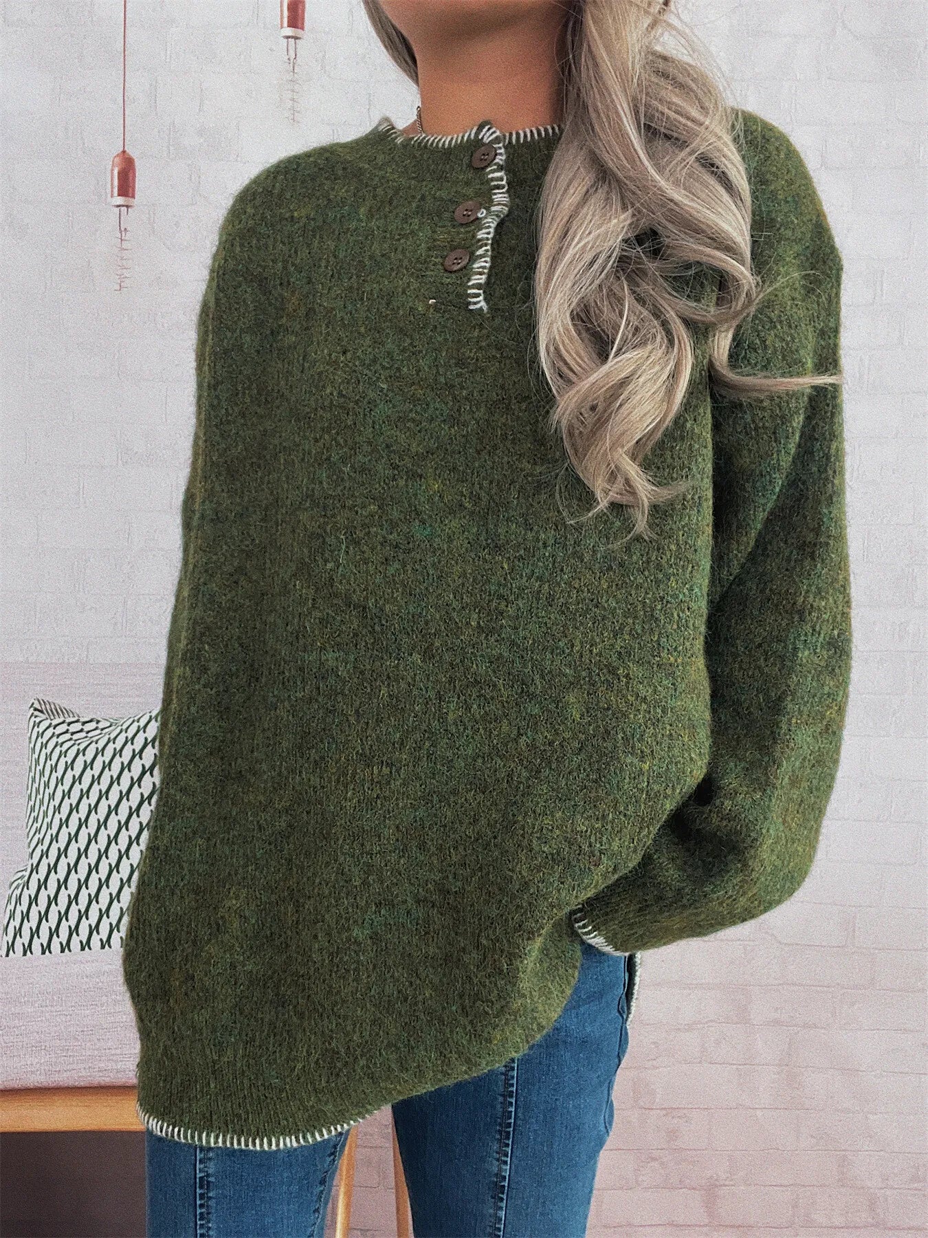Oversized ribbed long sleeve sweater with button detail and contrast stitching in polyester.