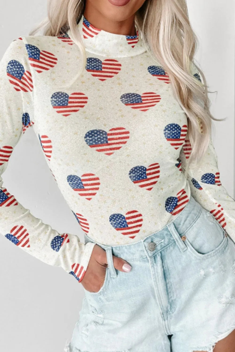 Sheer long sleeve bodysuit with US flag heart design and slightly stretchy fabric.