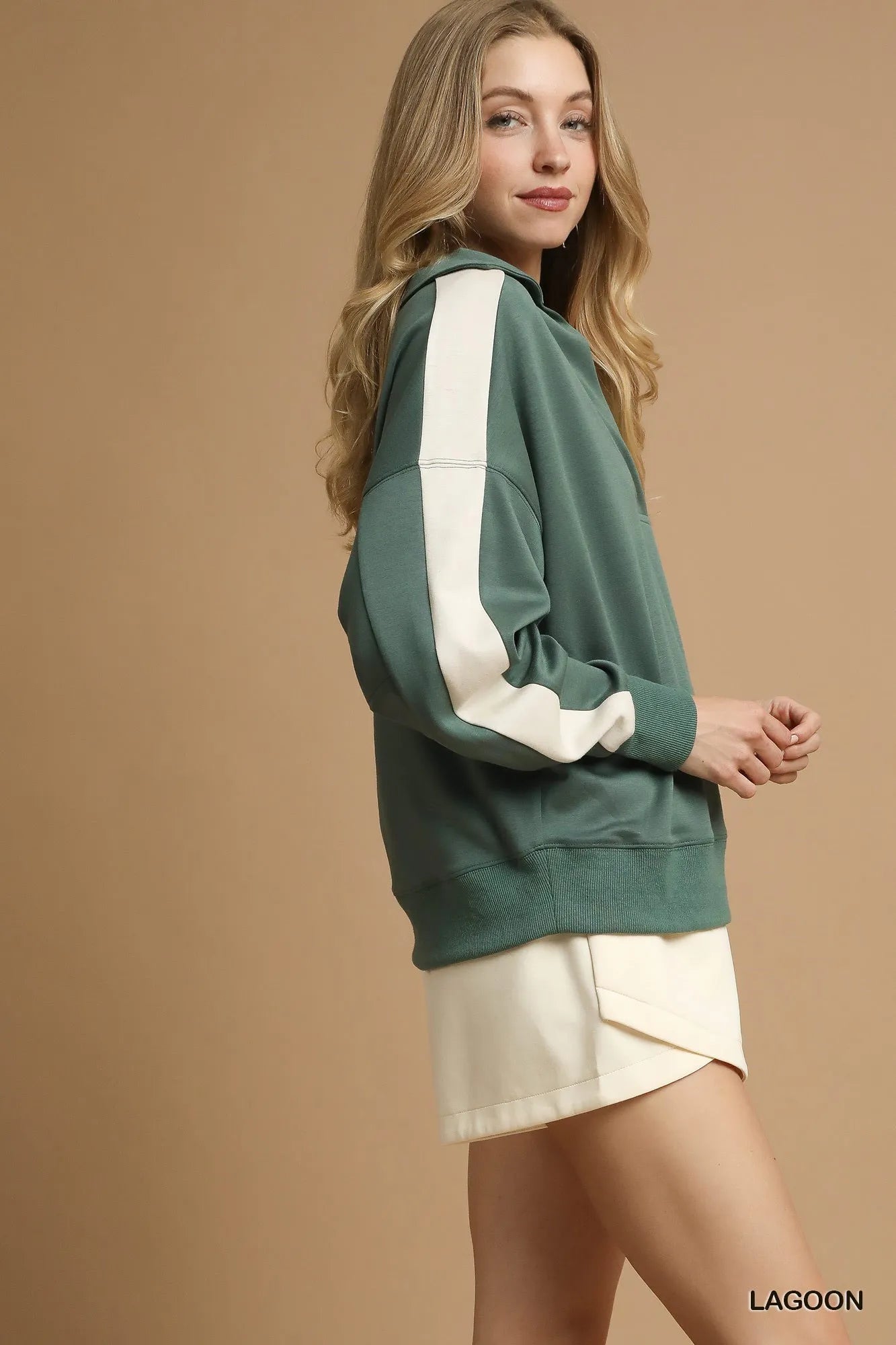 Sage green oversized long sleeve sweatshirt with white contrast sleeve stripes.