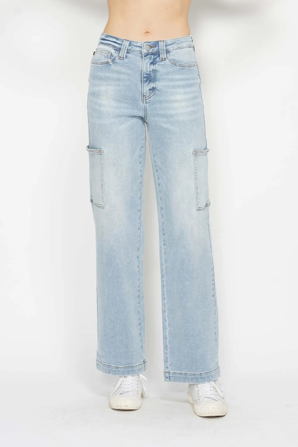 High-waist straight-leg cargo jeans in light wash with multiple pockets.