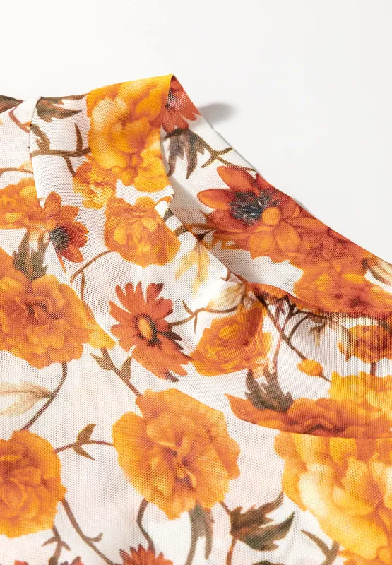 Flare sleeve mock neck top in slightly stretchy polyester with an elegant printed design.