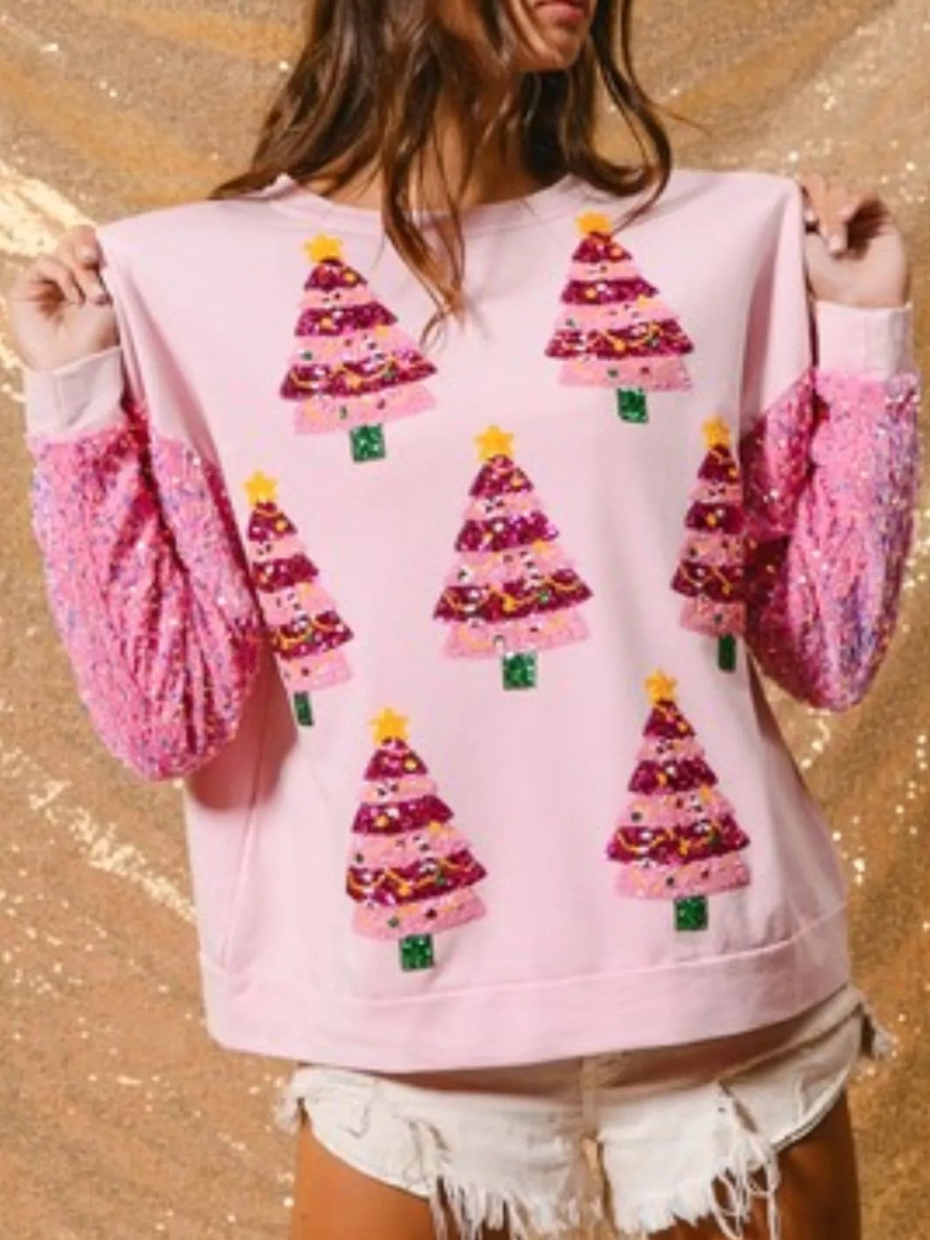 Long sleeve sweatshirt with sequins, designed for comfort and festive occasions.