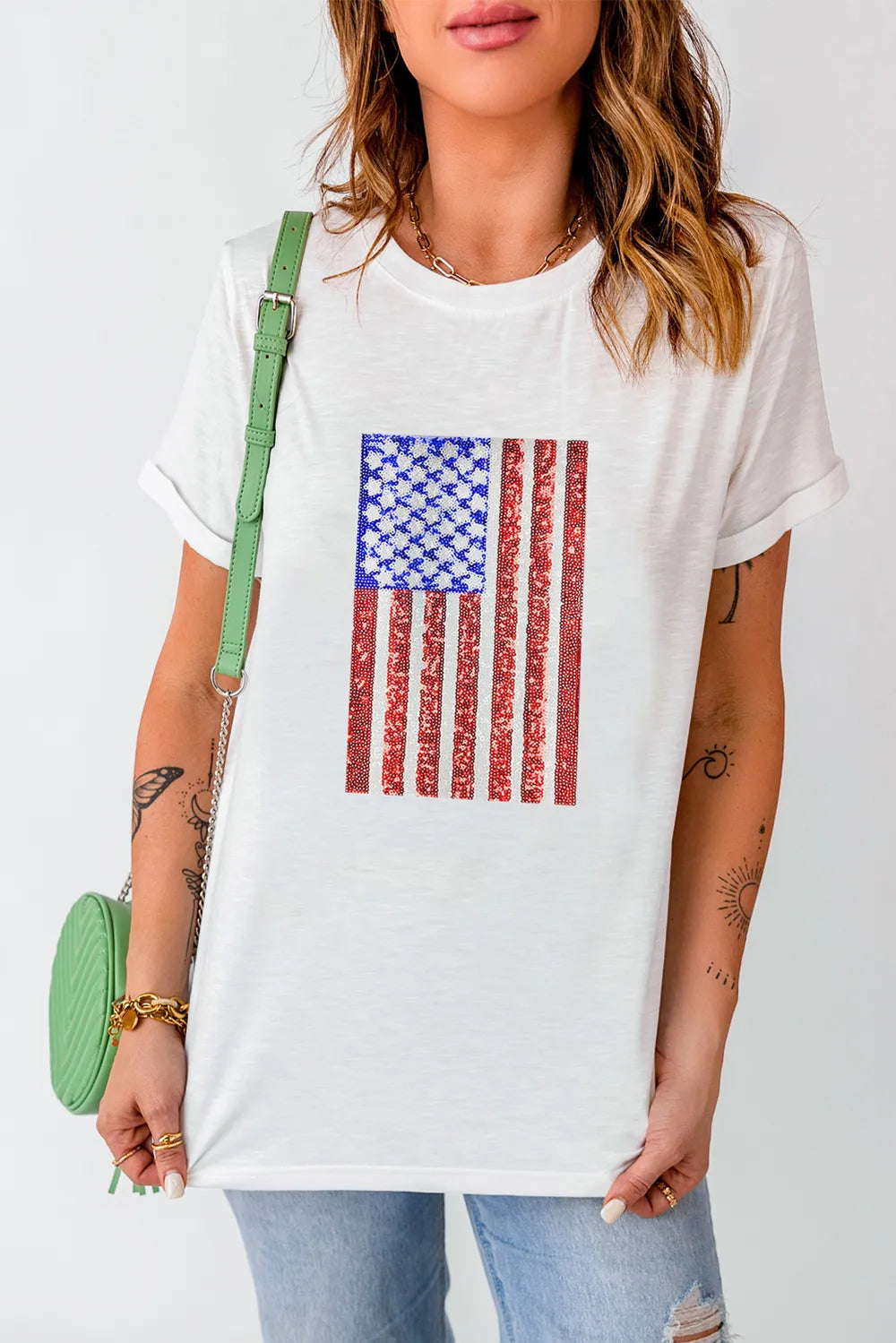 Round neck short sleeve t-shirt with US flag design in a cotton blend fabric.