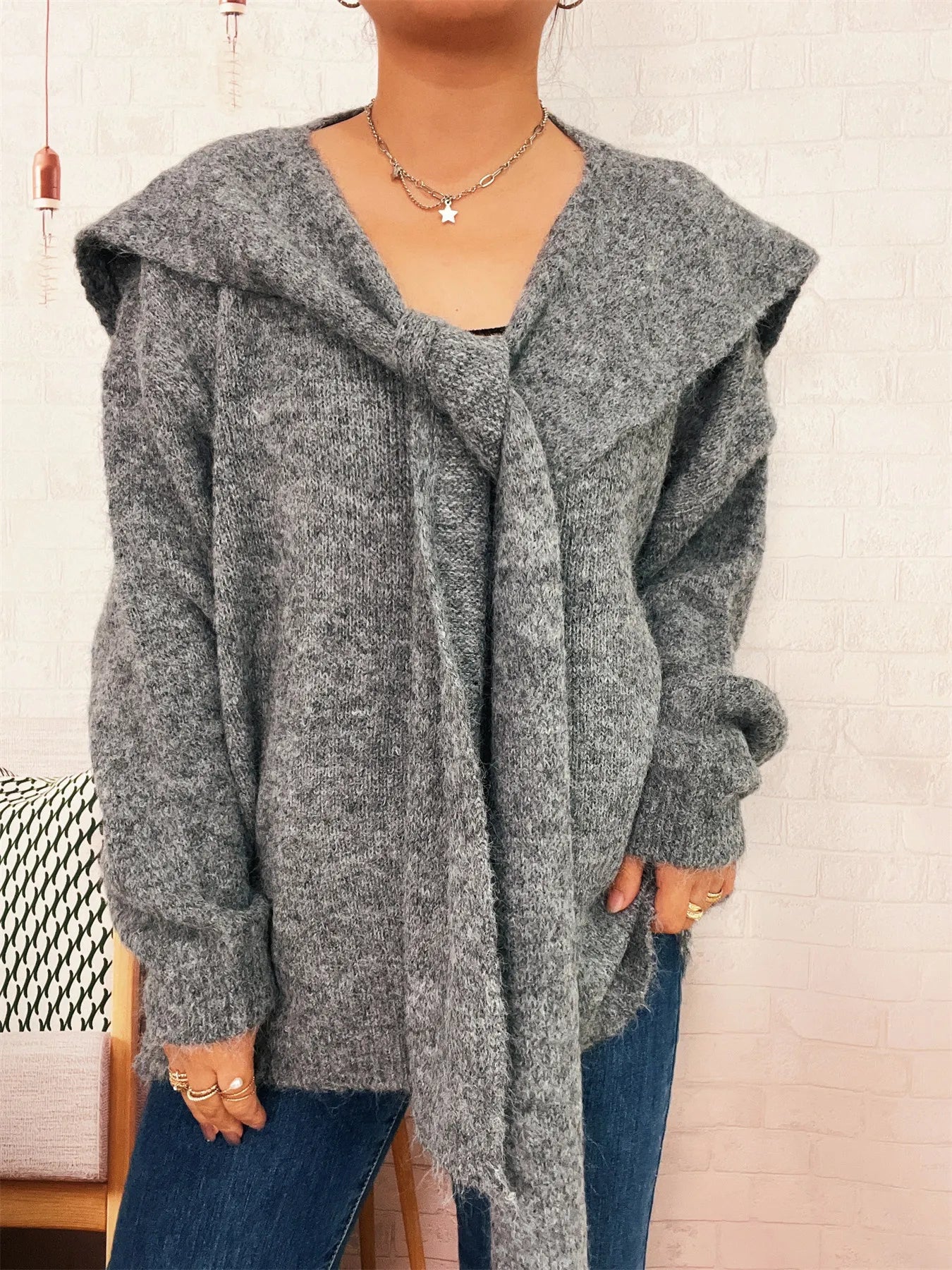 Ribbed hem V-neck sweater with shawl collar in black polyester fabric and long sleeves