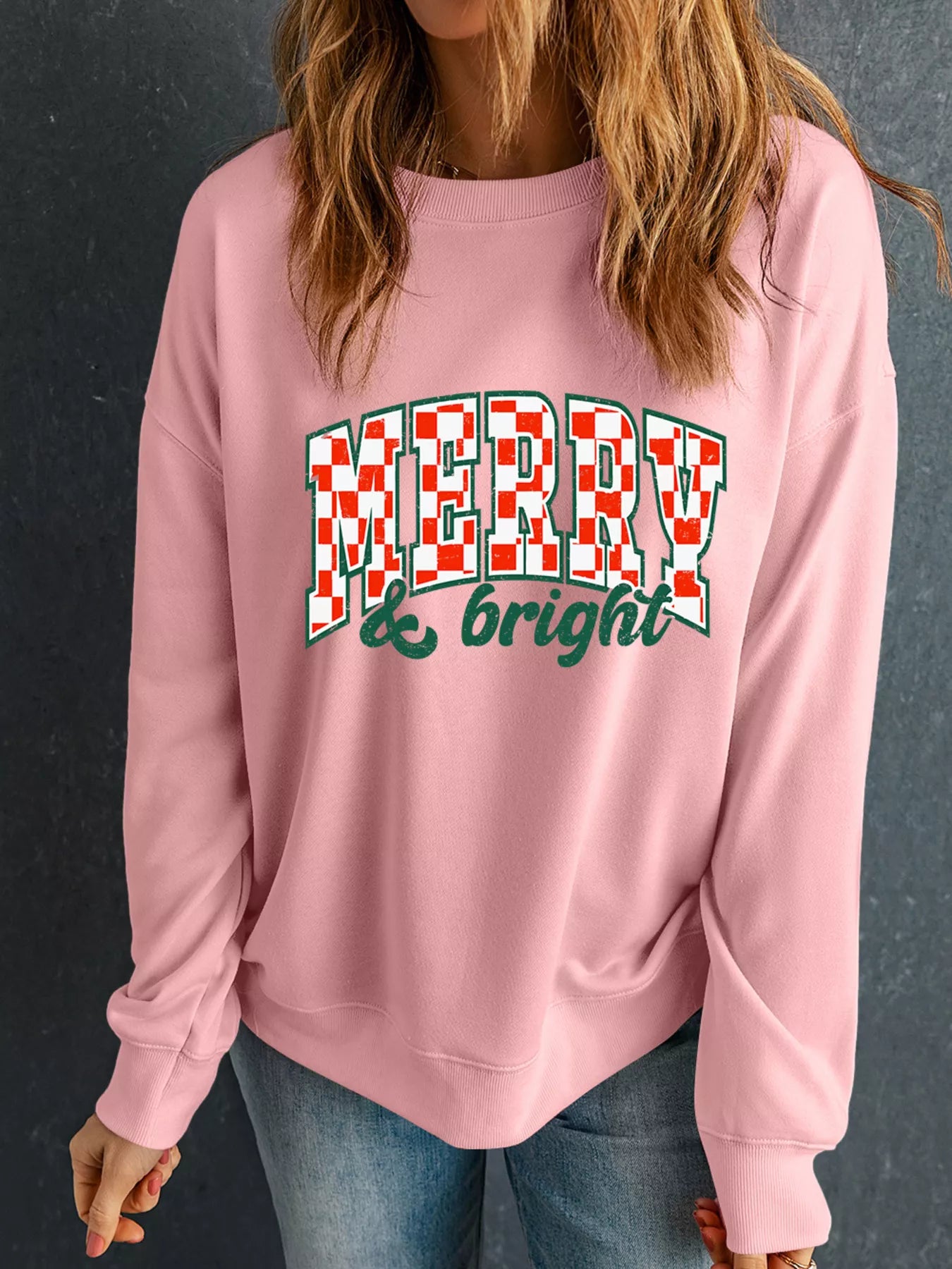 Long sleeve cotton blend sweatshirt with Merry & Bright Christmas graphic in red and white colors