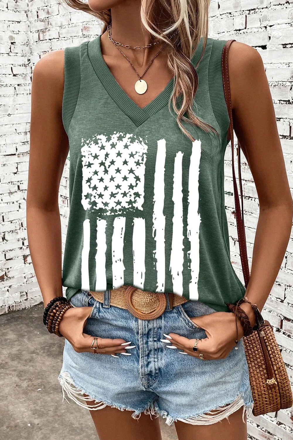 Red, white, and blue US flag V-neck tank top made of a slightly stretchy polyester blend.