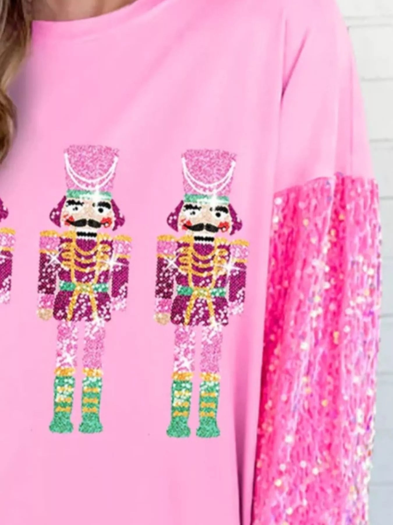 Long sleeve sweatshirt with subtle sequins and a comfortable fit for holiday wear.