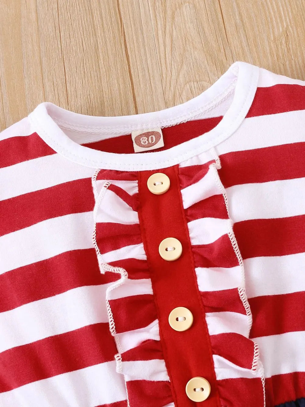 Striped stars ruffled cap sleeve dress made of polyester blend with decorative buttons