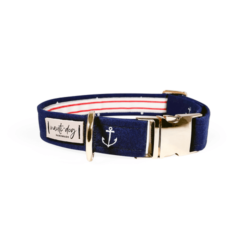 Navy nautical dog collar with red stripes, anchor embroidery, and gold buckle.