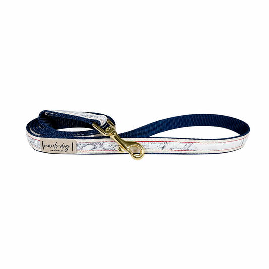 Navy and white dog leash with vintage nautical map print and brass clasp.