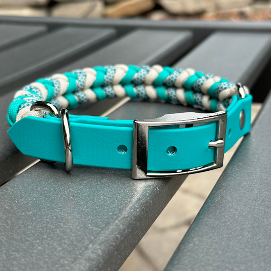 Teal and cream diamond-pattern hand-braided dog collar with adjustable BioThane strap and buckle.