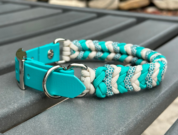 Hand-braided teal and cream diamond-pattern dog collar with adjustable BioThane strap and D-ring.