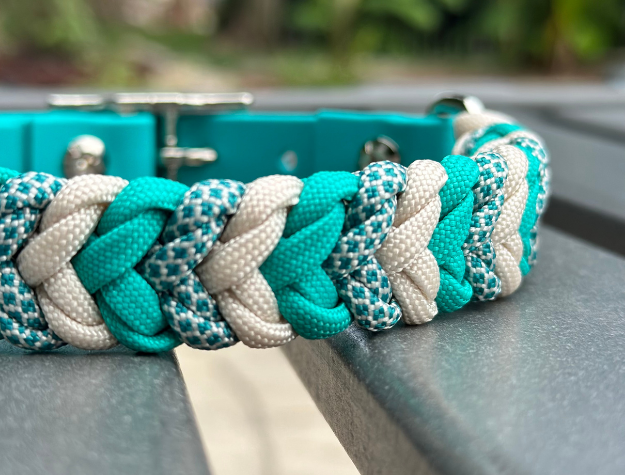 Teal and cream diamond-pattern hand-braided dog collar with adjustable strap.