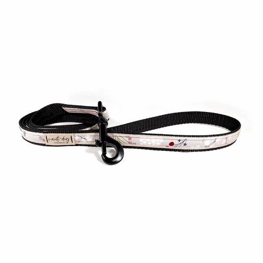 Black nylon dog leash with elderberry silver floral ribbon and metal clip.