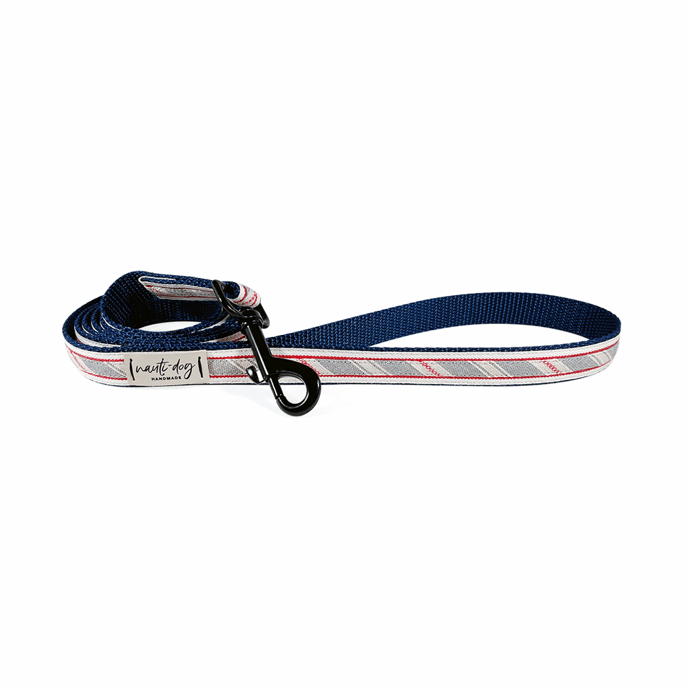 Navy blue woven stripe dog leash with red and white ribbon accents and metal clip.