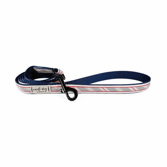 Navy blue woven stripe dog leash with red and white ribbon accents and metal clip.