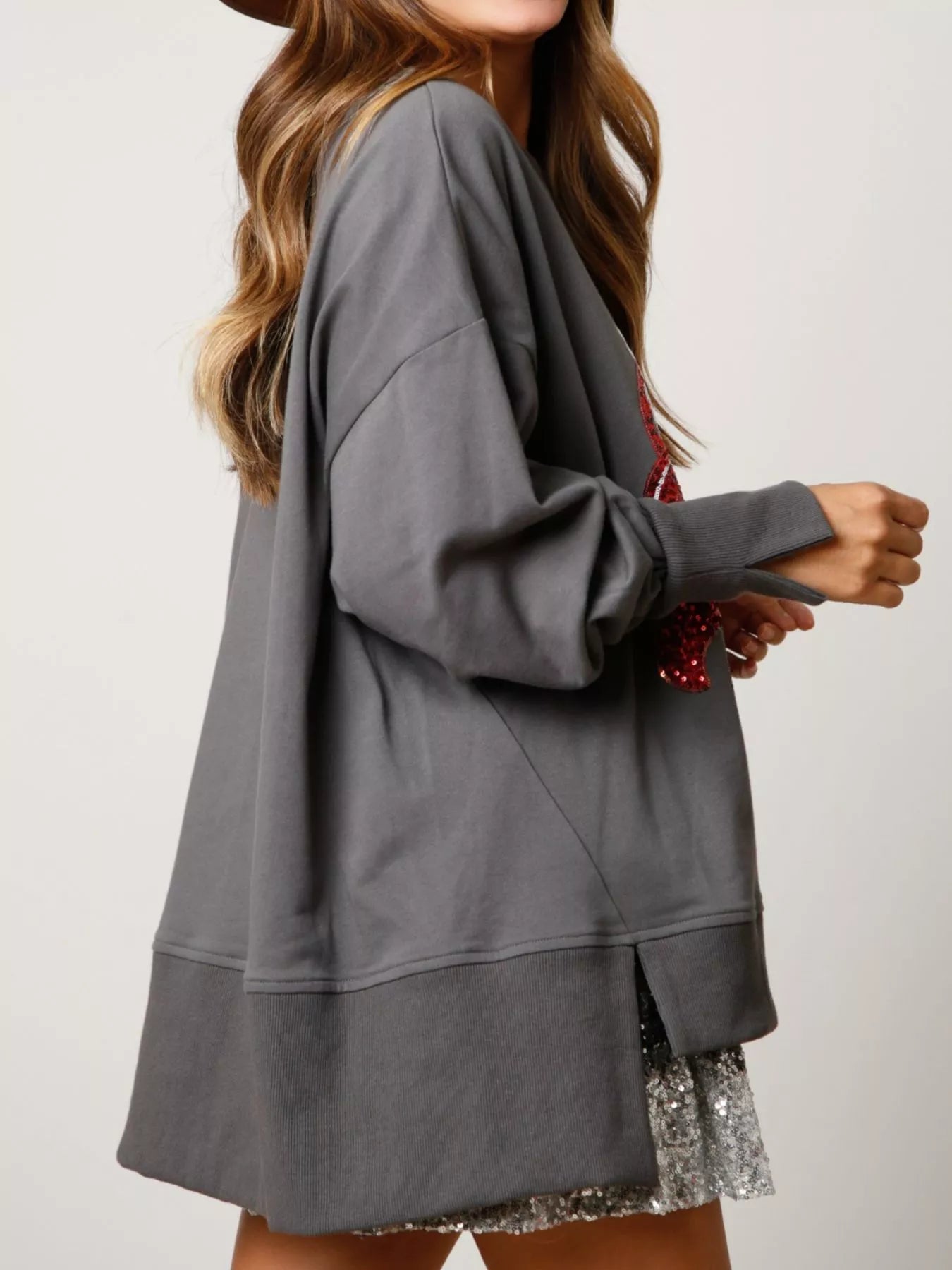 Trendsi sequin sweatshirt with high-low hem and subtle sparkle in polyester fabric