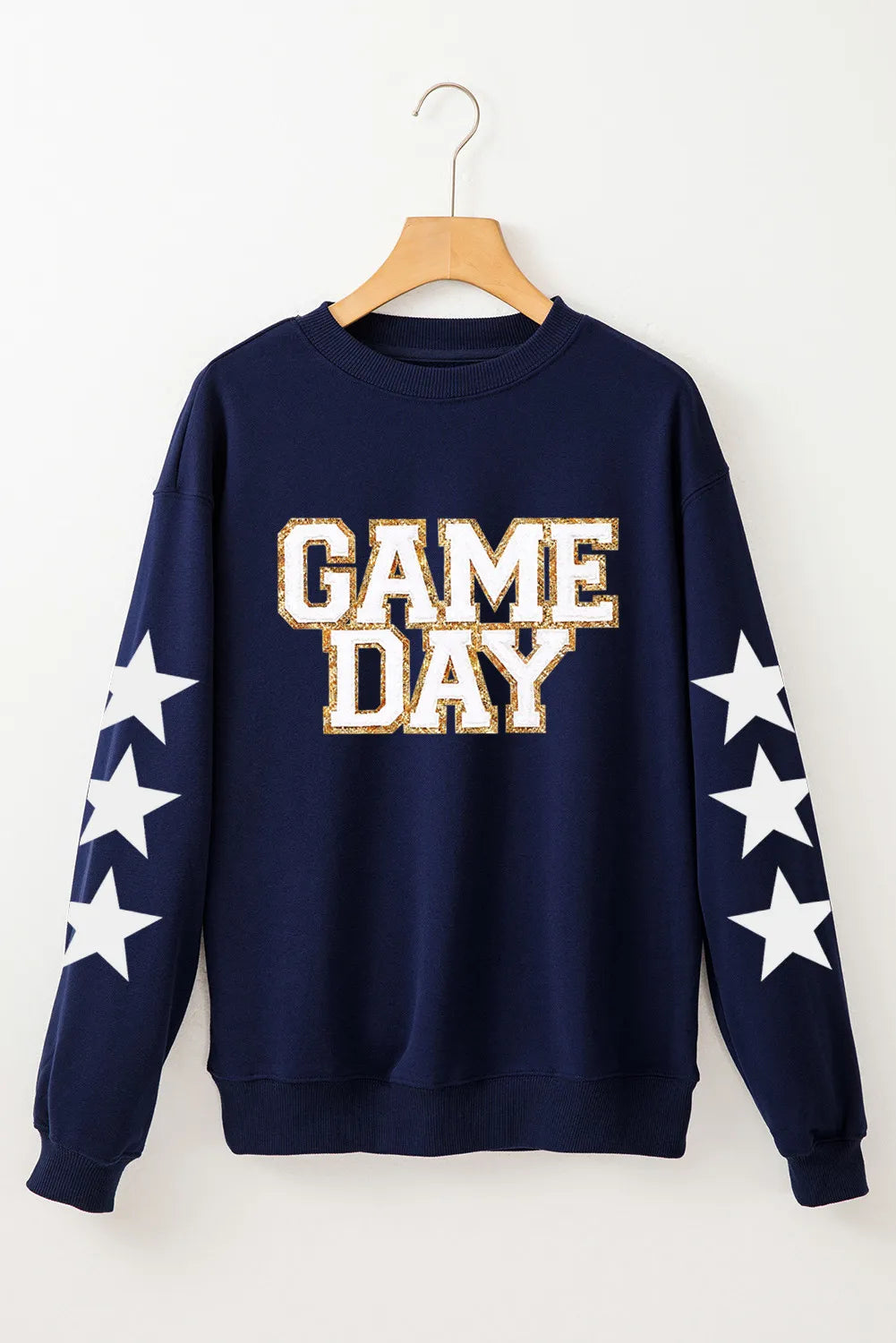 Long sleeve sweatshirt with a glitter sheer design in a cotton-polyester blend.