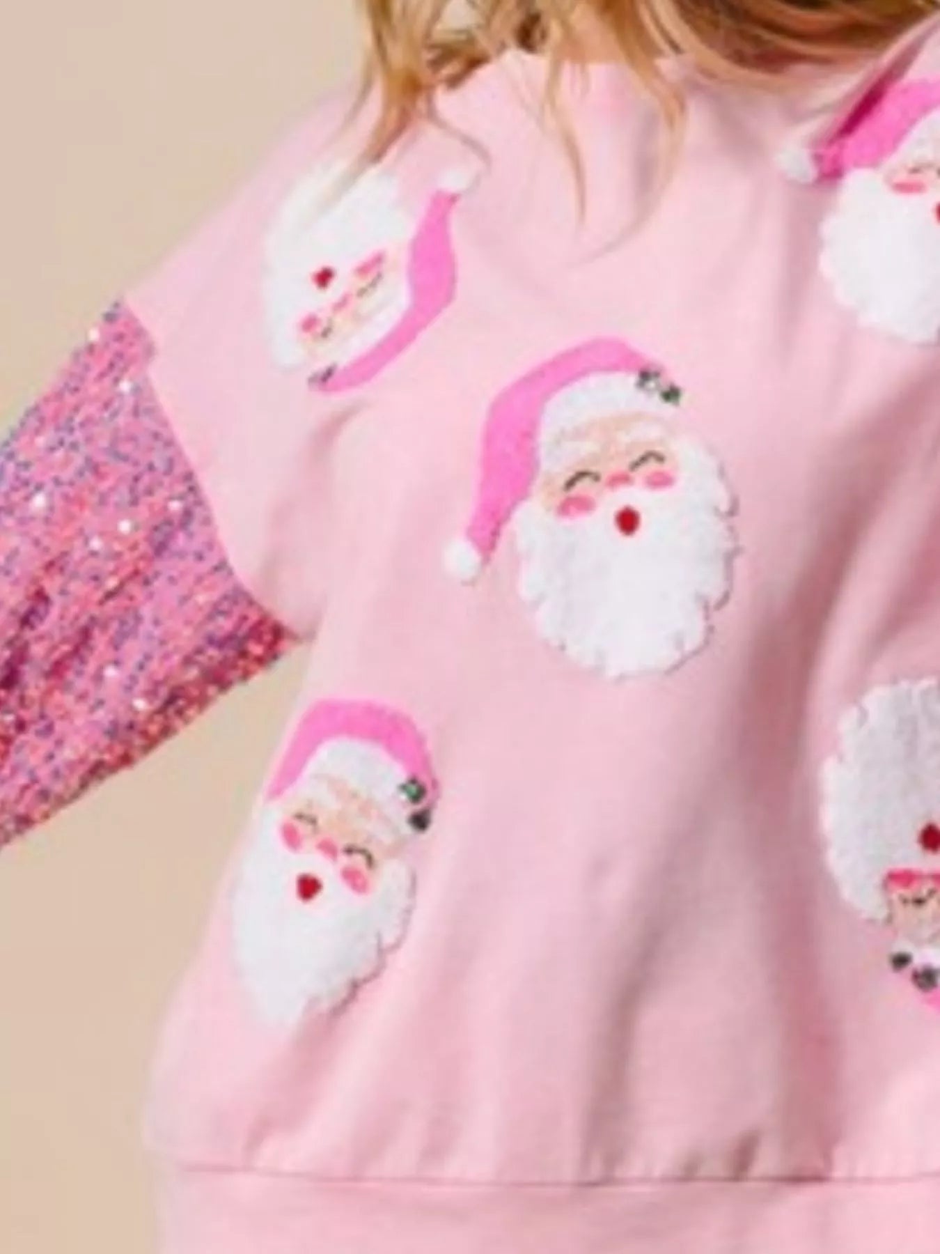 A cozy long sleeve sweatshirt with delicate sequins for a festive touch.