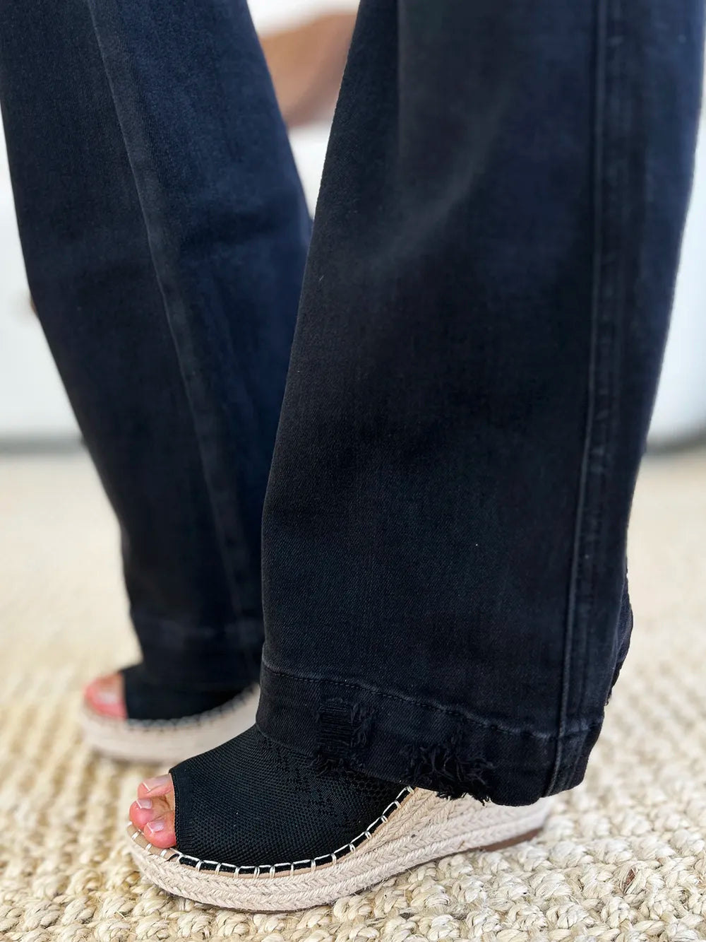 Dark wash Judy Blue high-waist distressed flare jeans with frayed hems.