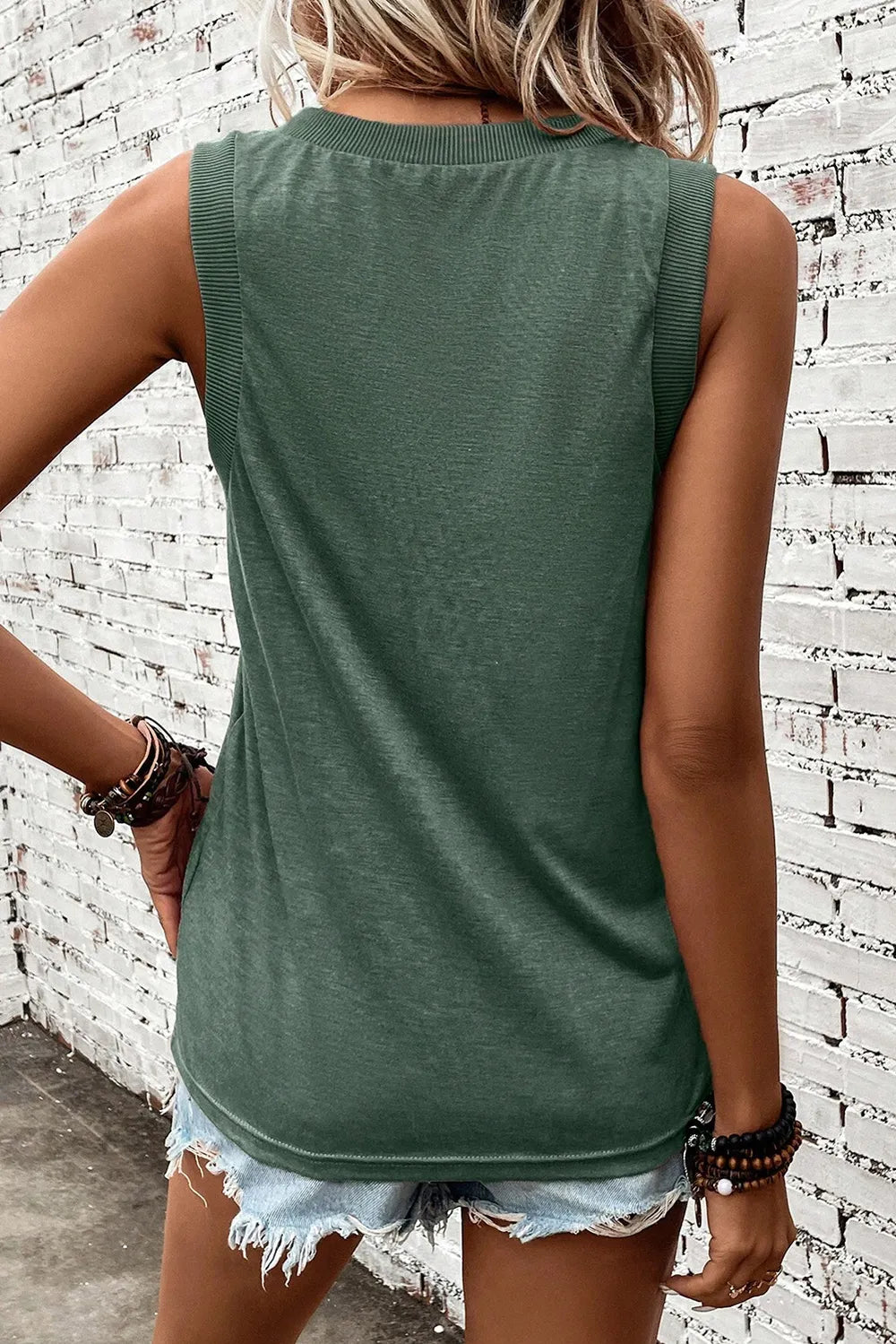V-neck tank top with US flag design, made of slightly stretchy polyester blend.