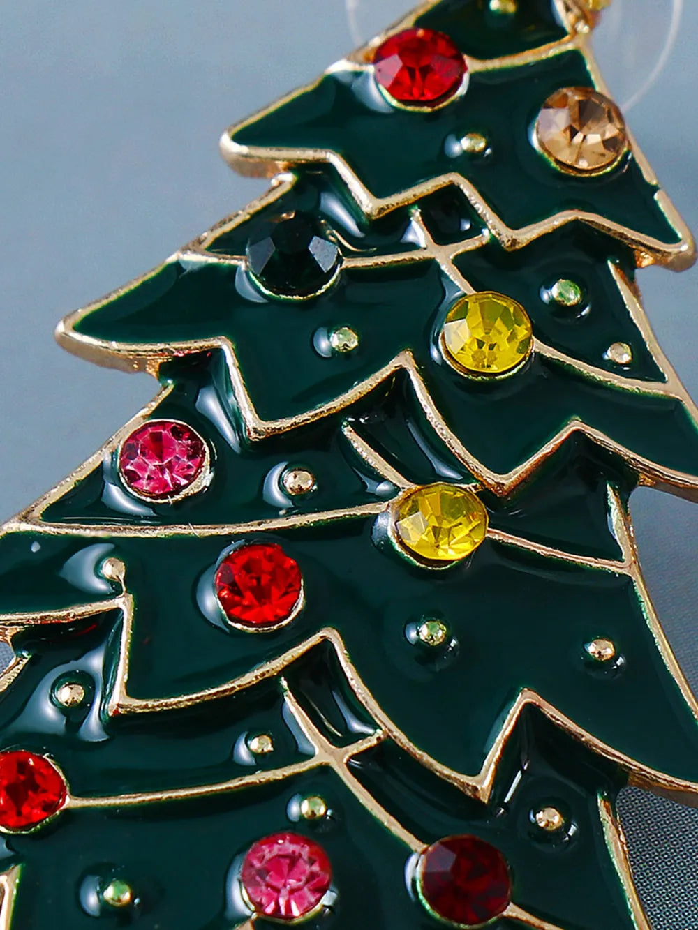 Alloy inlaid rhinestone Christmas tree earrings with green enamel and colorful gems.