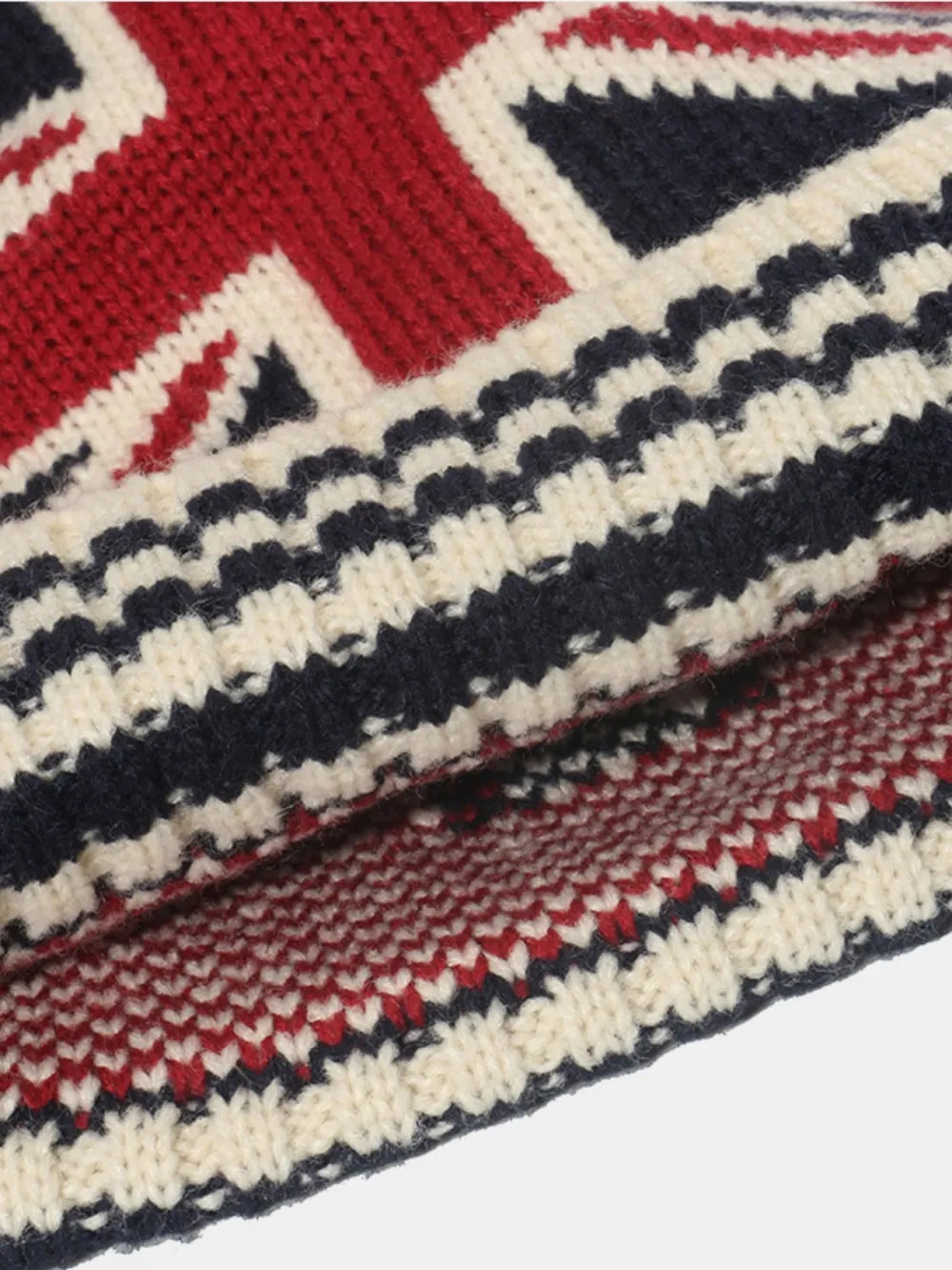 Acrylic blend knit hat with a roll rim featuring the US flag design.