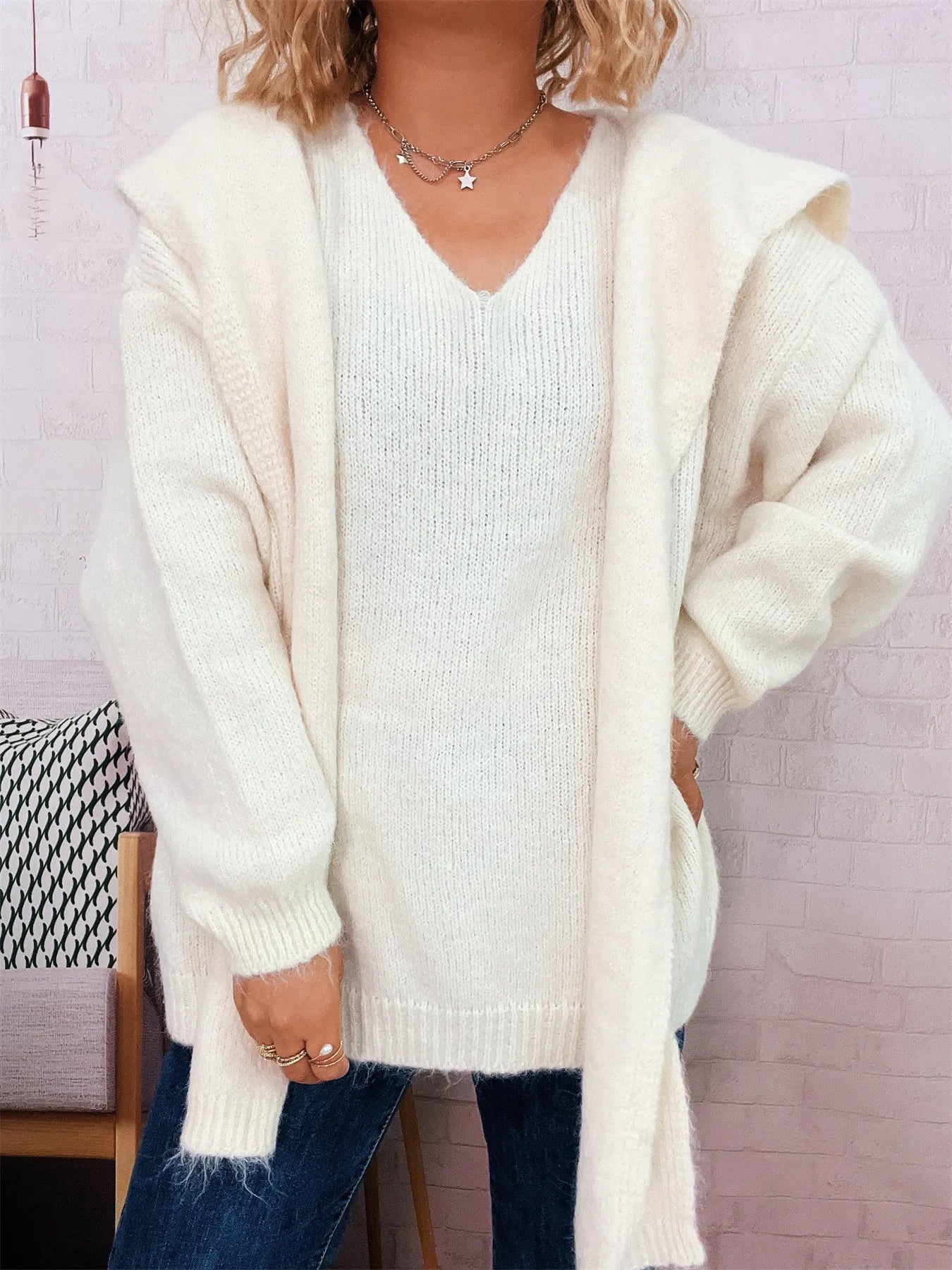 Ribbed hem V-neck sweater with shawl collar in black polyester fabric and long sleeves