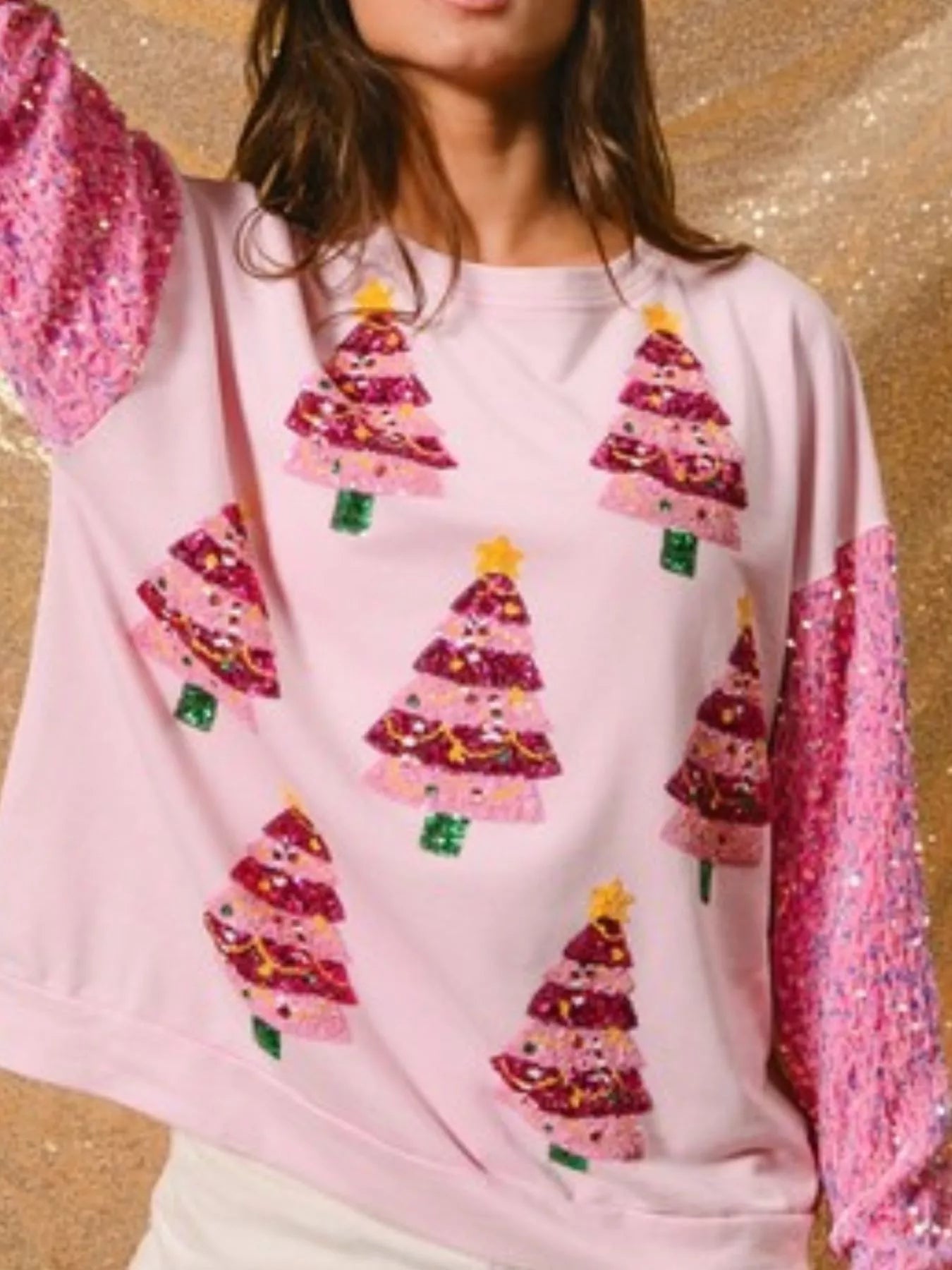 Long sleeve sweatshirt with sequins, featuring a comfortable fit and subtle holiday shimmer.