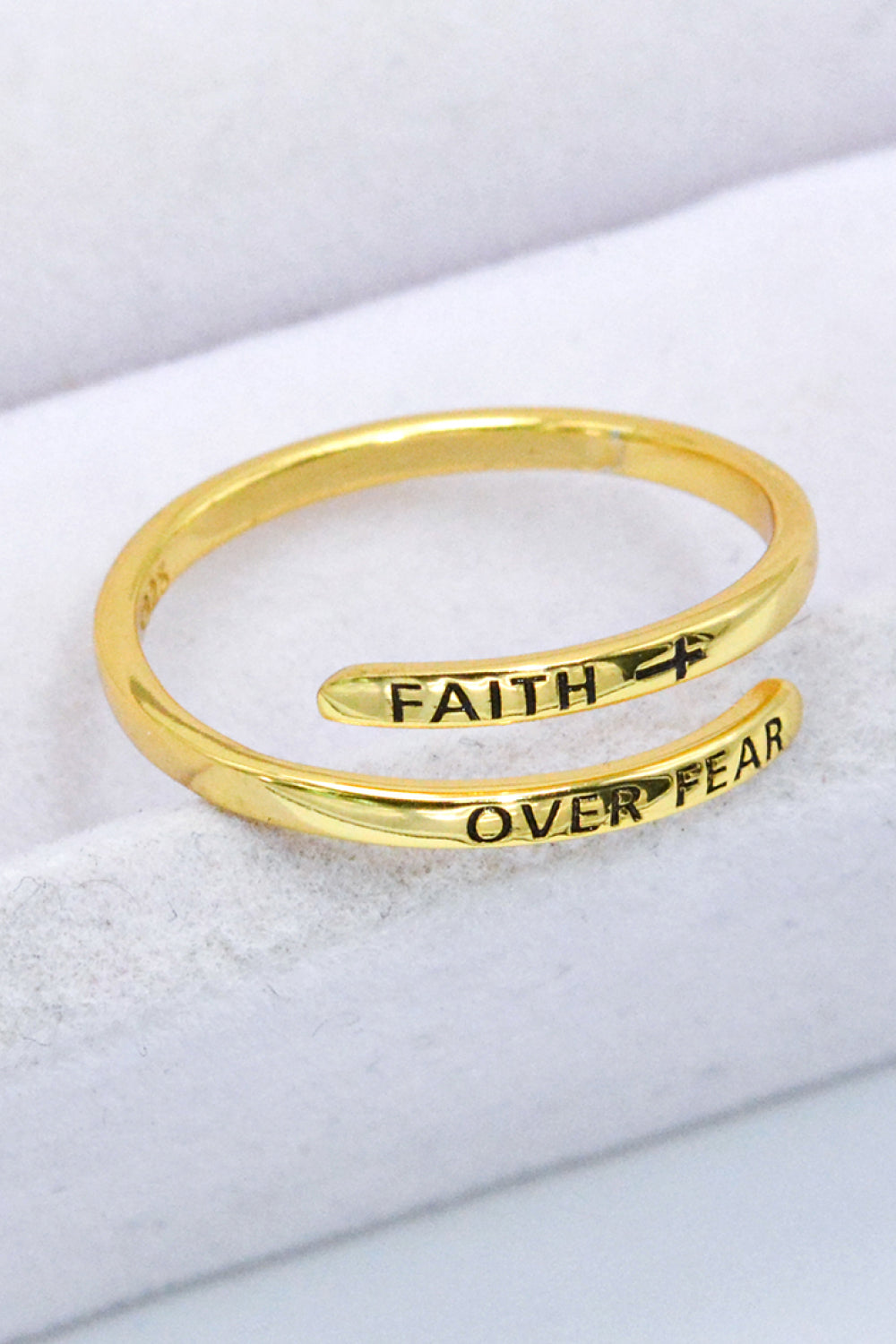 Gold-plated sterling silver bypass ring engraved with "Faith Over Fear.