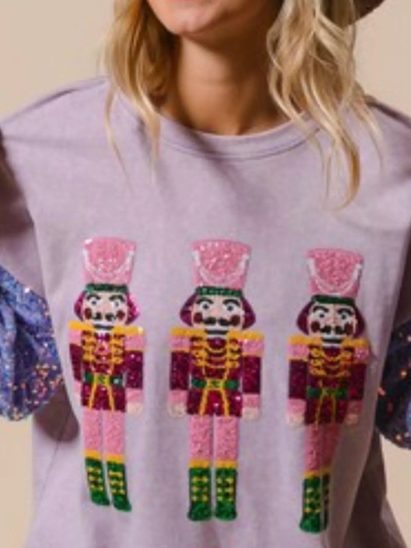 Long sleeve sweatshirt with sequins, designed for comfort and festive style.