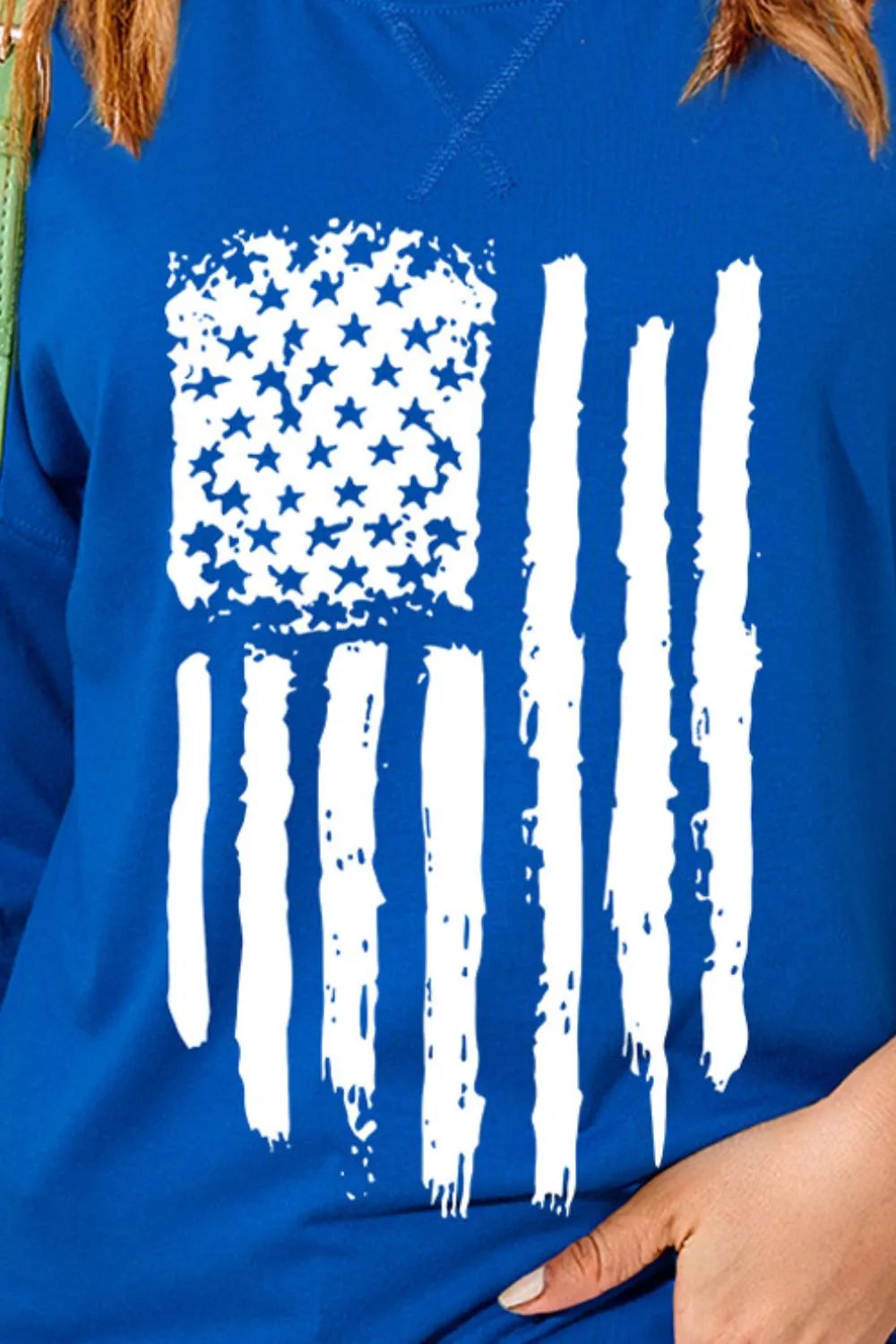 Short sleeve t-shirt with US flag design, made from a polyester-cotton blend.