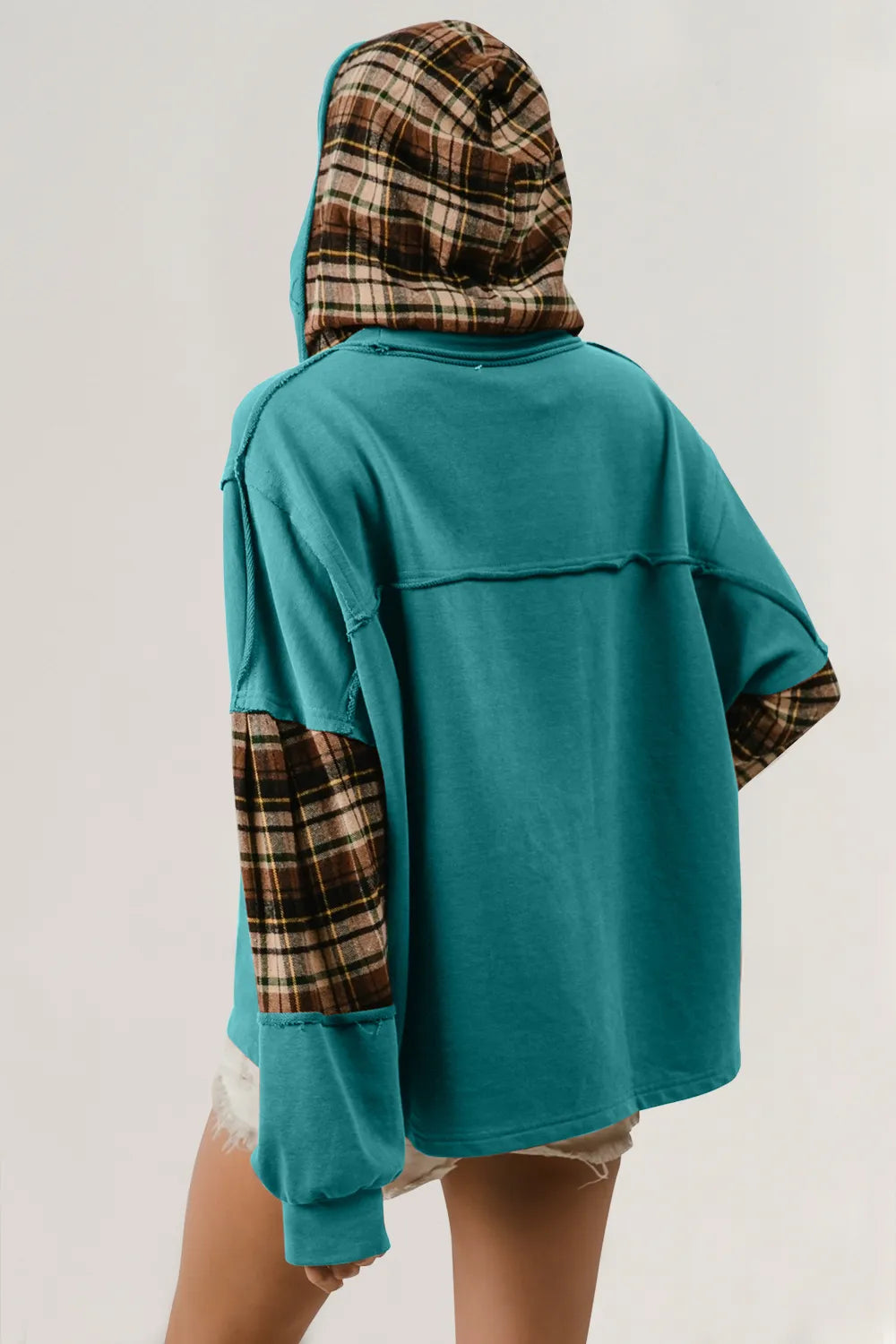 Plaid hoodie with star patch and drawstring, slightly stretchy fabric in neutral tones.