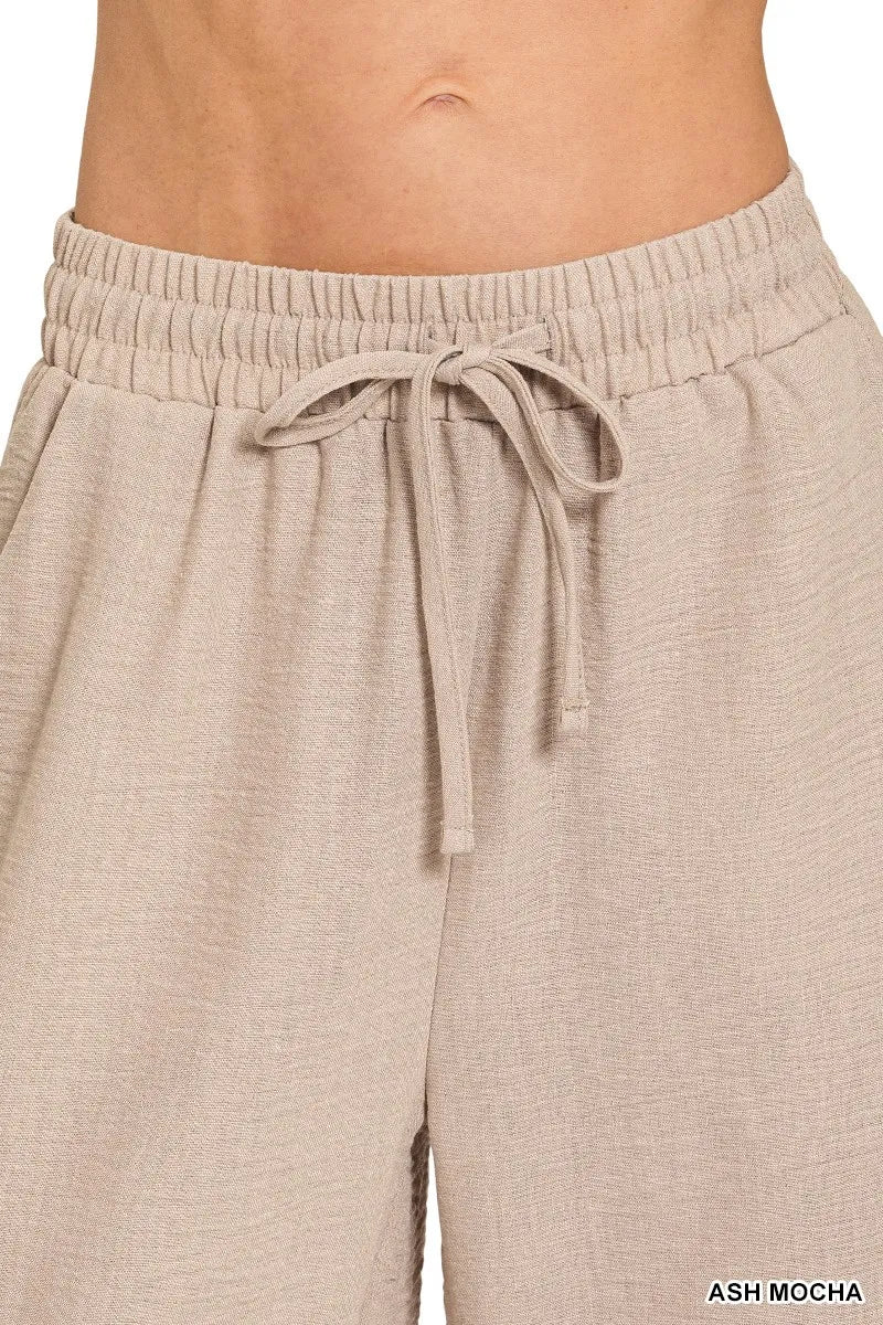 Ash mocha woven crepe wide-leg pants with elastic drawstring waist.