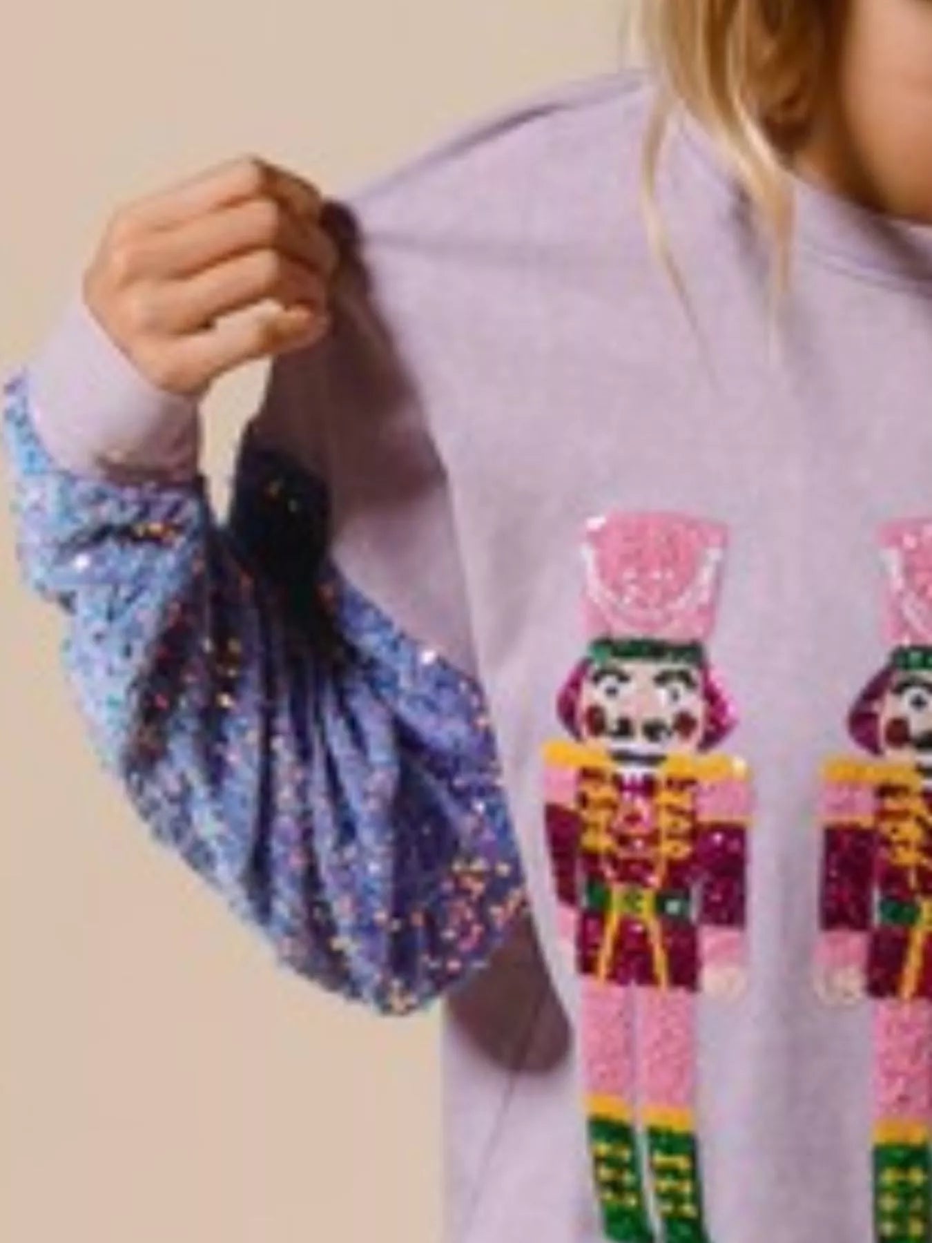 Long sleeve sweatshirt with sequins and a relaxed fit, ideal for holiday wear.