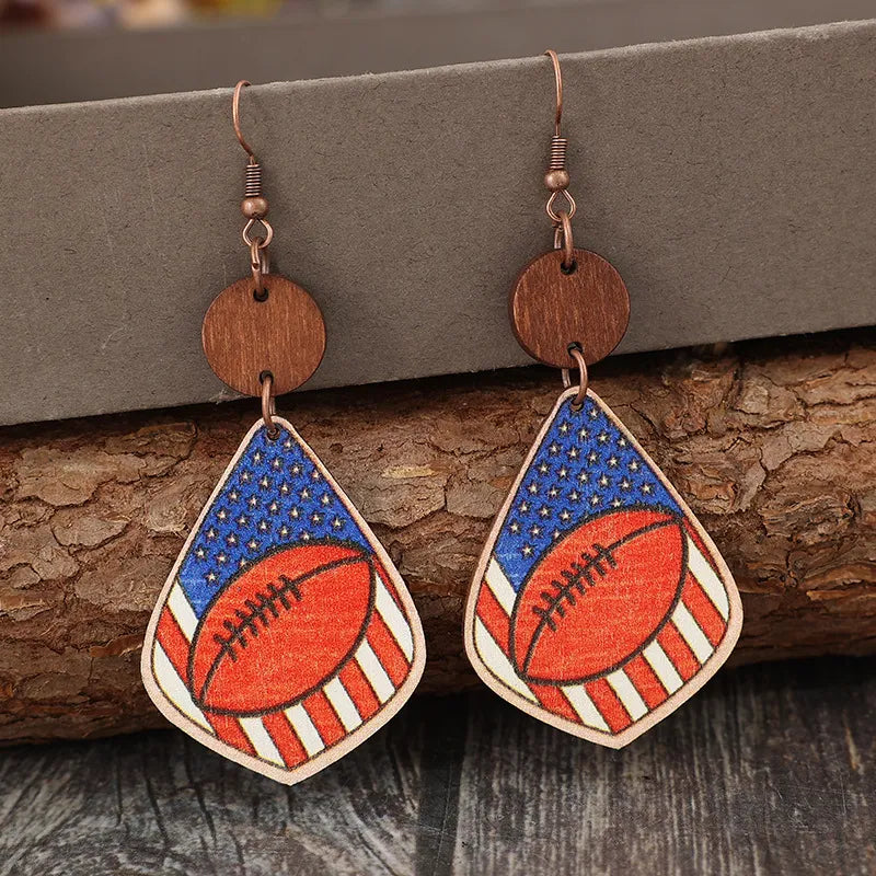 Wooden dangle earrings with alloy accents, measuring 3.3 inches in length.