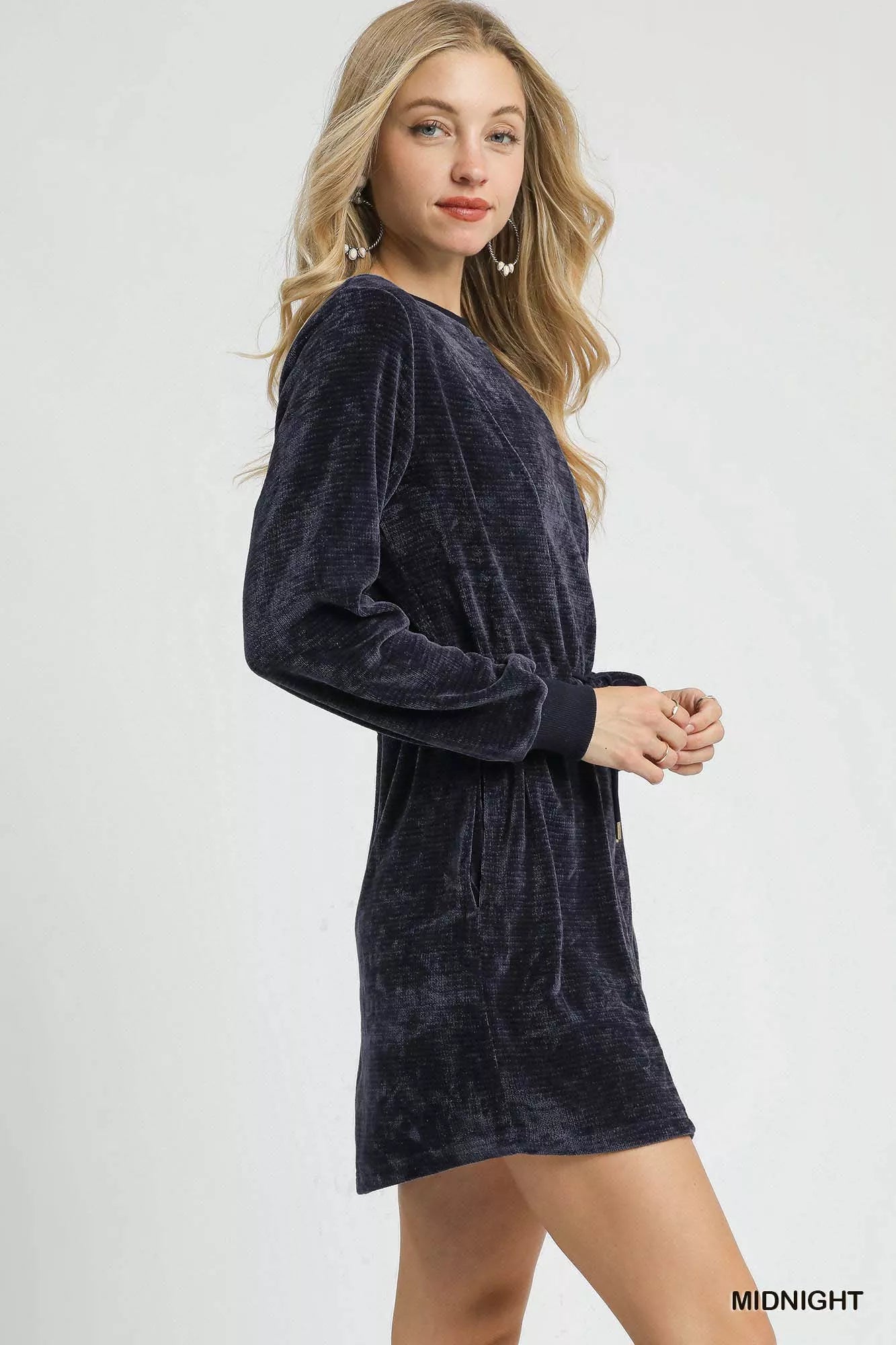 Navy velour drawstring long sleeve mini dress on a model.