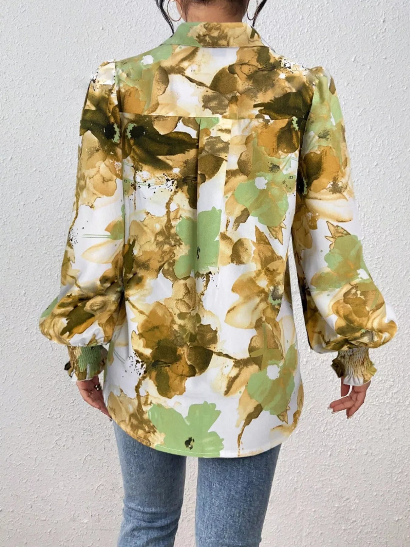 Printed button-up shirt with lantern sleeves in a polyester blend fabric.