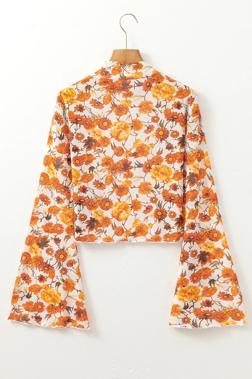 Printed mock neck top with flare sleeves in slightly stretchy polyester fabric.