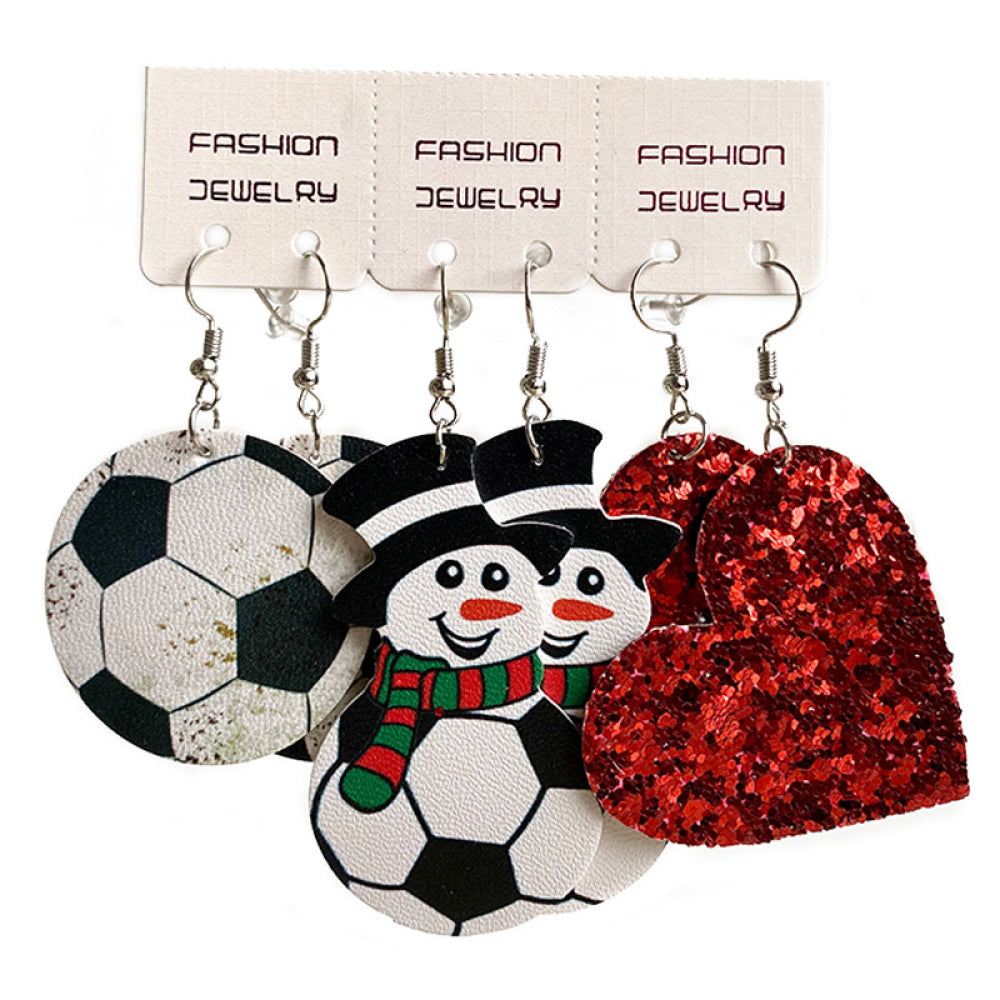 Set of iron charm earrings with snowman, soccer ball, and heart designs.